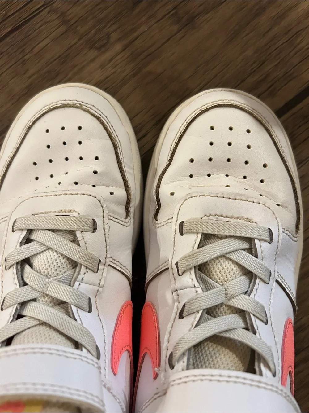 Nike Kids White Sneakers with Coral Swoosh and Yellow Tongue